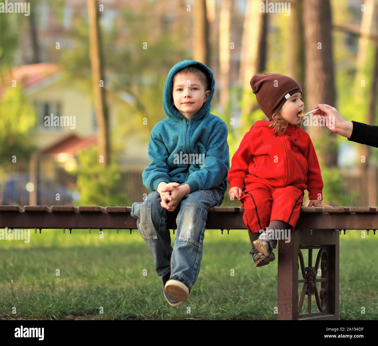 Girl Sitting On Park Bench High Resolution Stock Photography and Images