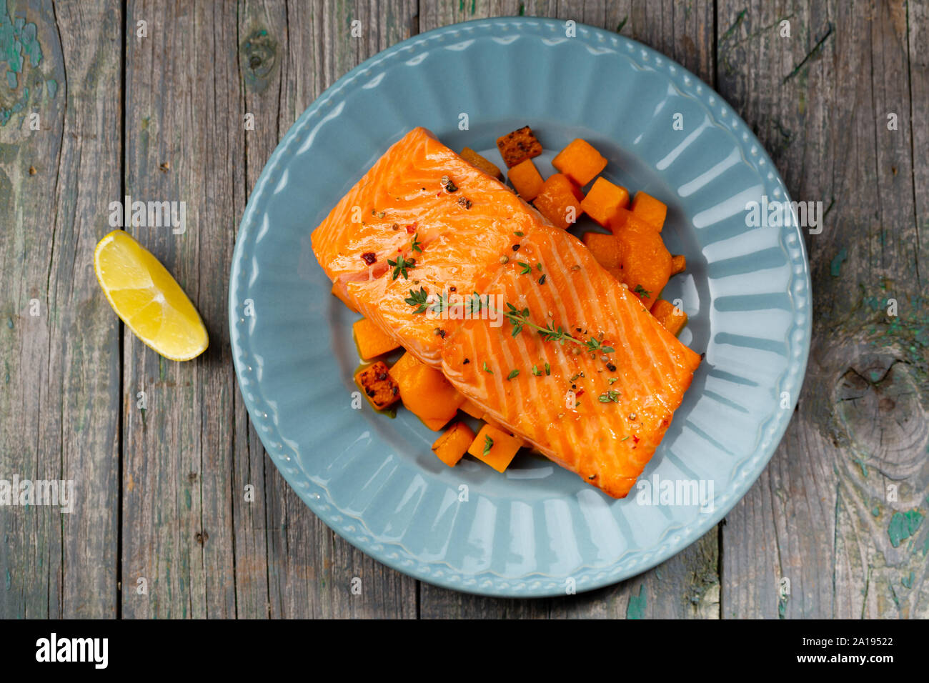 Grilled fish and pumpkin sauce, fennel Stock Photo Alamy