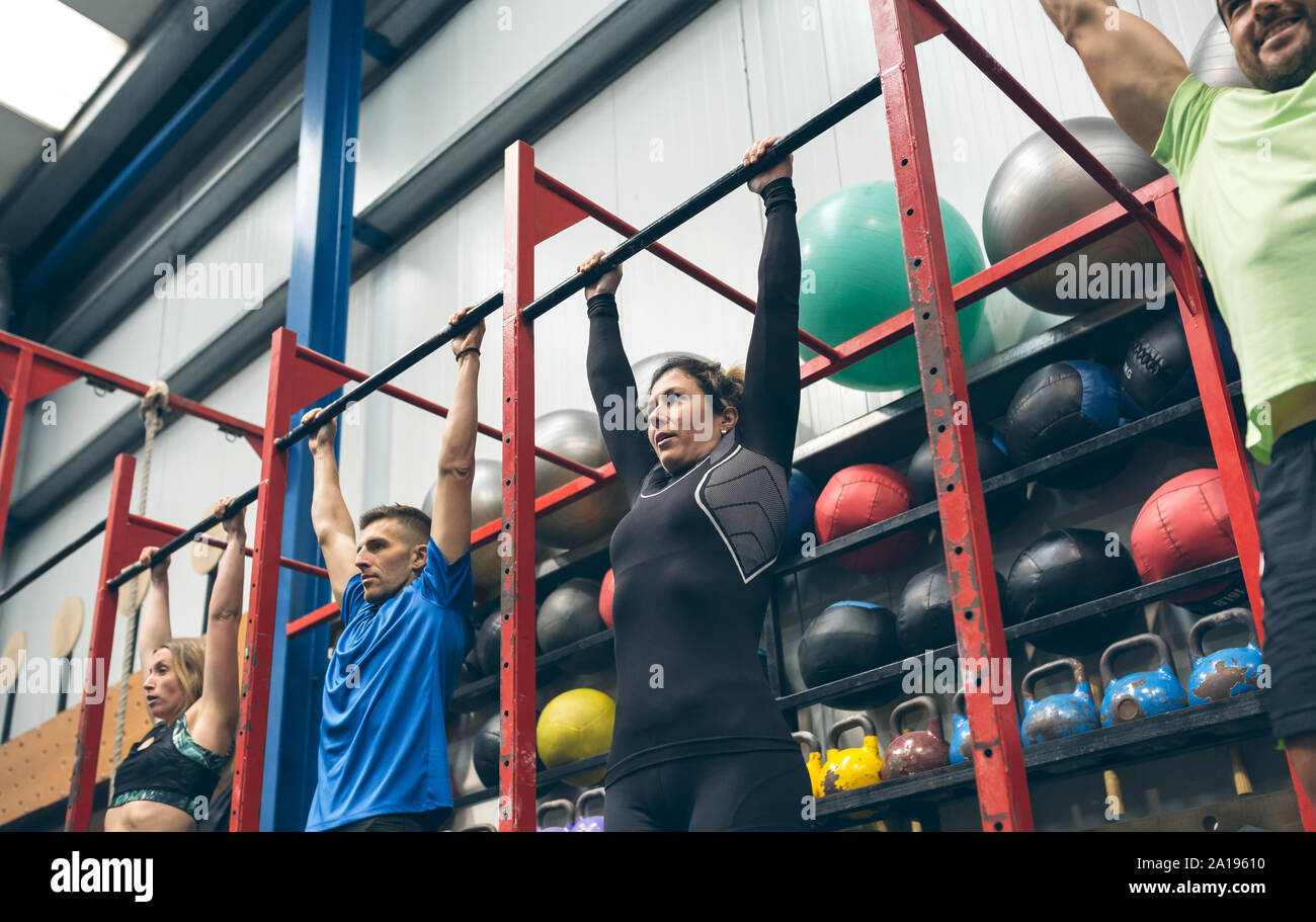 Athletes ready to do pull ups in the box Stock Photo