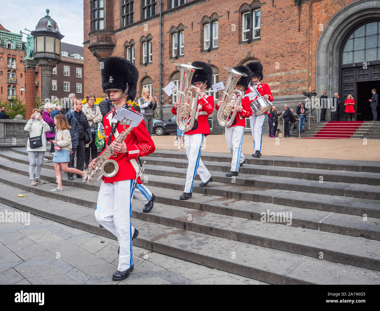 Copenhagen, Denmark - May 28, 2019: The Tivoli Gardens Youth Guard band in red gala uniform next to City Hall   in Kopenhagen, Denmark, Drums and Fife Stock Photo