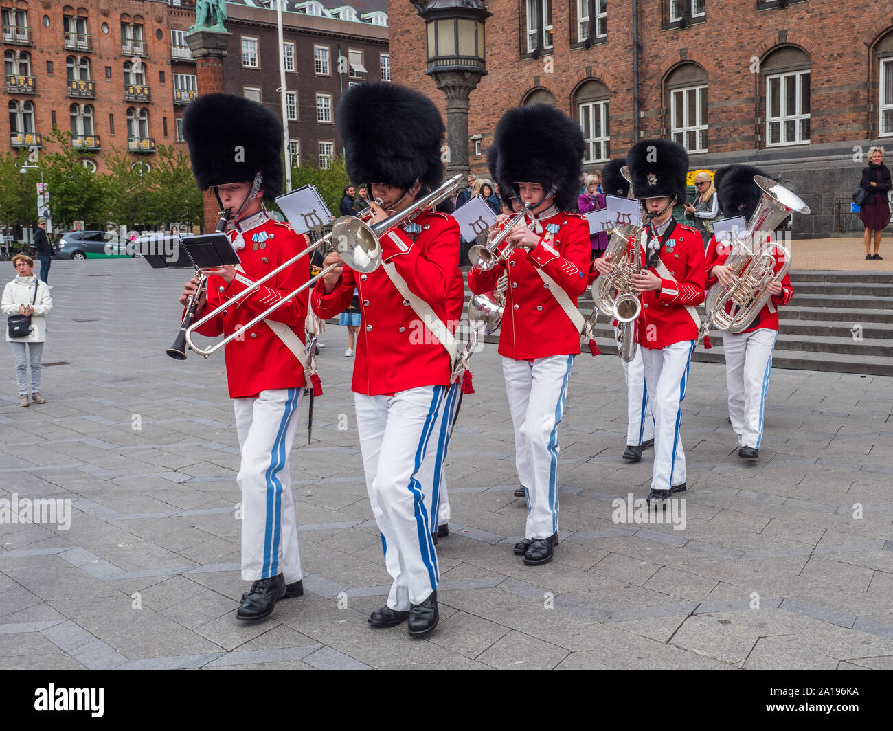 Copenhagen, Denmark - May 28, 2019: The Tivoli Gardens Youth Guard band in red gala uniform next to City Hall   in Kopenhagen, Denmark, Drums and Fife Stock Photo