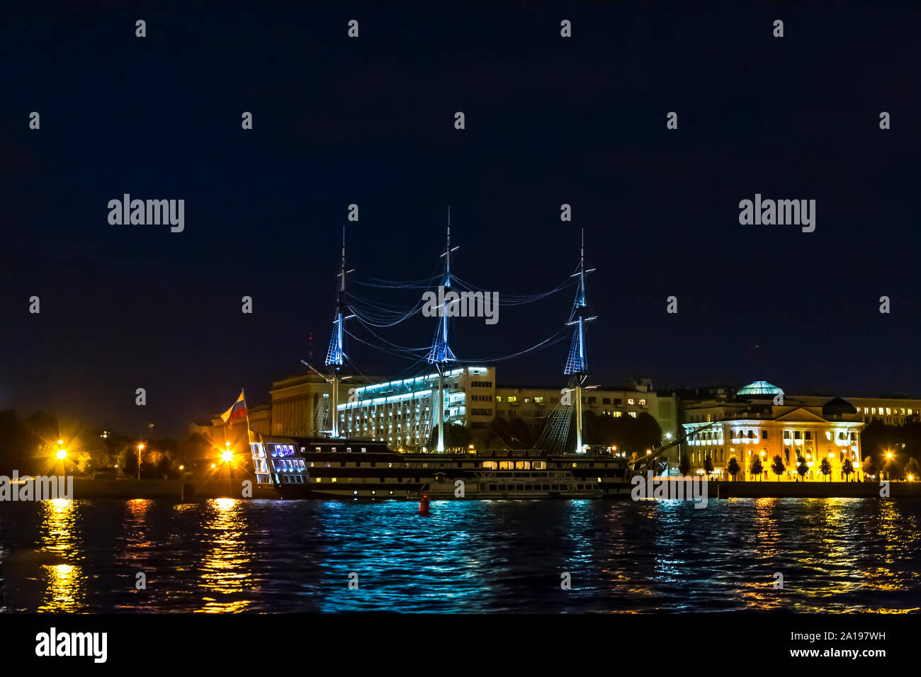 Fregat Blagodat, a floating restaurant on the River Neva illuminated during the evening, St Petersburg, Russia. Stock Photo