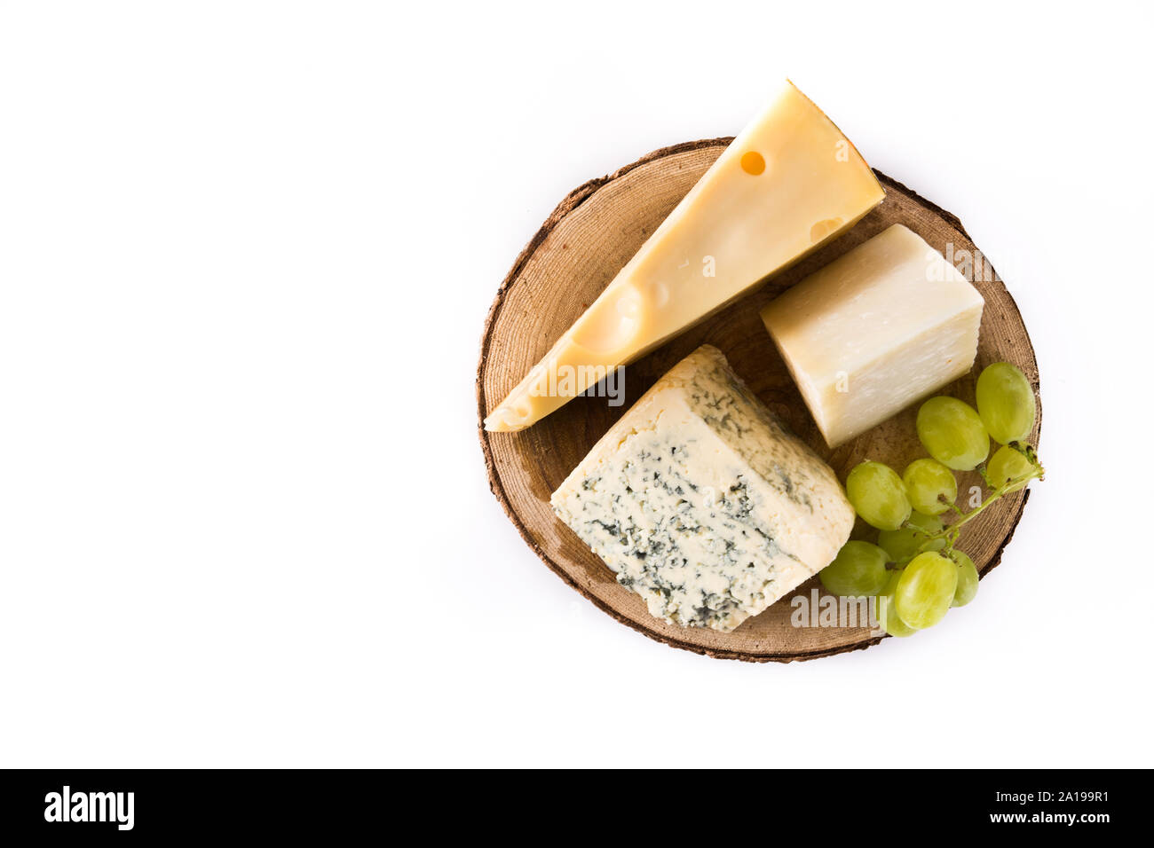 Different types of cheeses and green grapes isolated on white background. Top view. Copy space Stock Photo