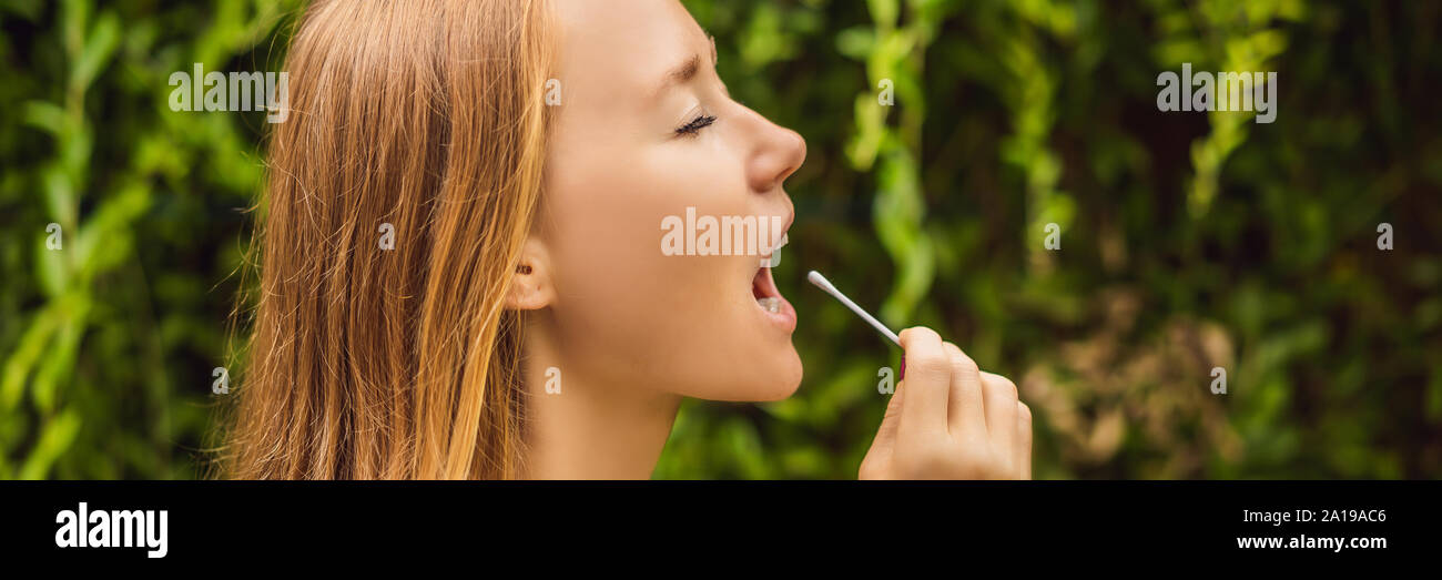 Woman doing DNA test with cotton swab. Test for home use BANNER, LONG