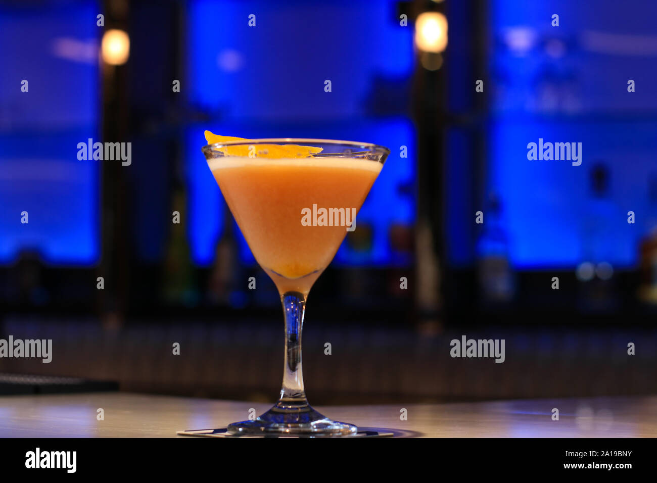 Alcoholic cocktail in a glass at a bar. Fruit cocktails decorated. Stock Photo