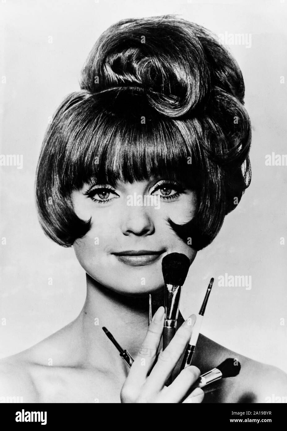 model, make-up brushes, 1960s Stock Photo