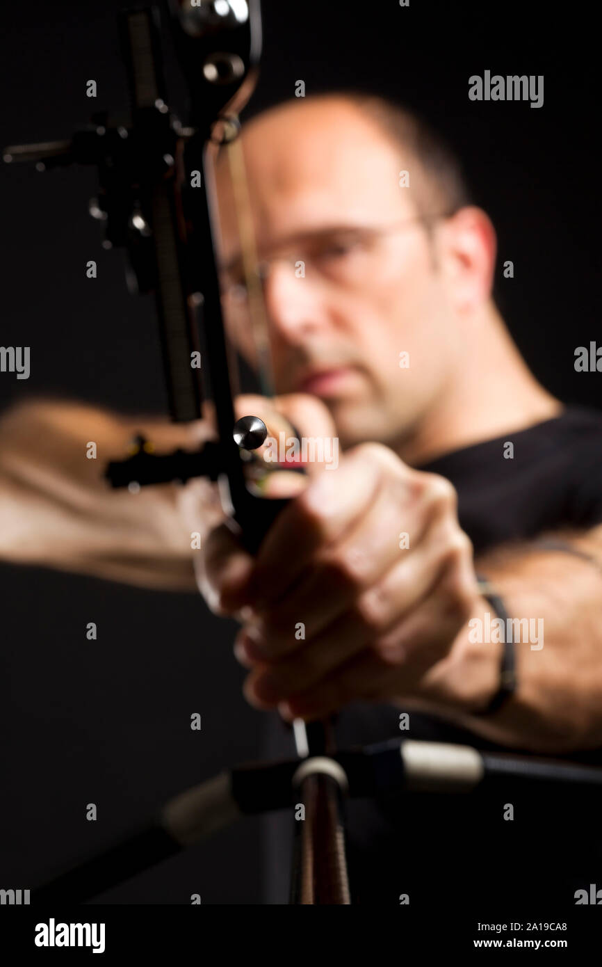 Front view of bowman with bow and arrow. Stock Photo