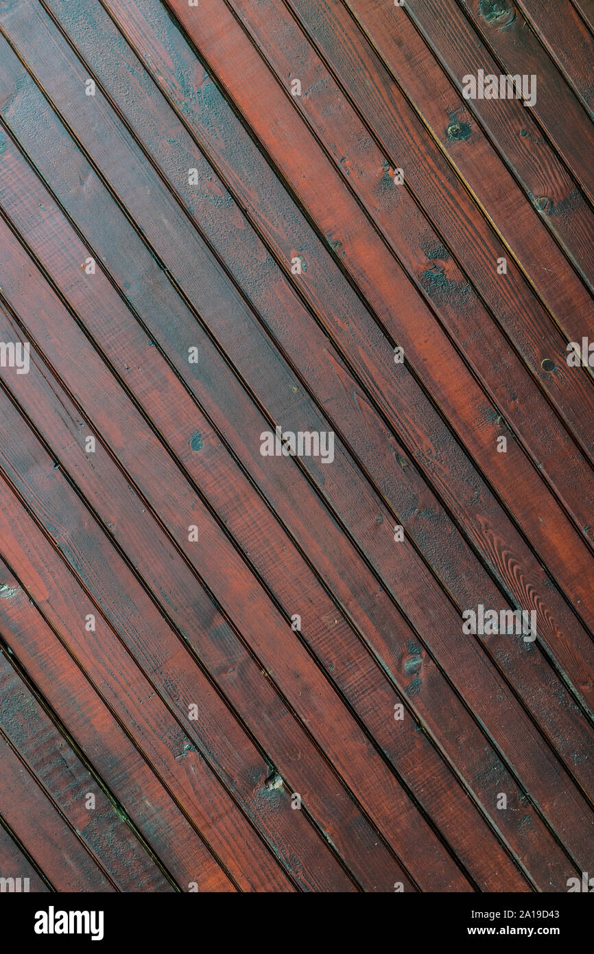 stained wood planks fence background - diagonals lines Stock Photo