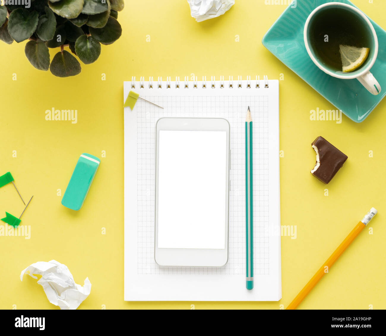 Download Top View Workspace Mockup On Yellow Background With Notebook Pen Tea Clips And Accessories Stock Photo Alamy PSD Mockup Templates