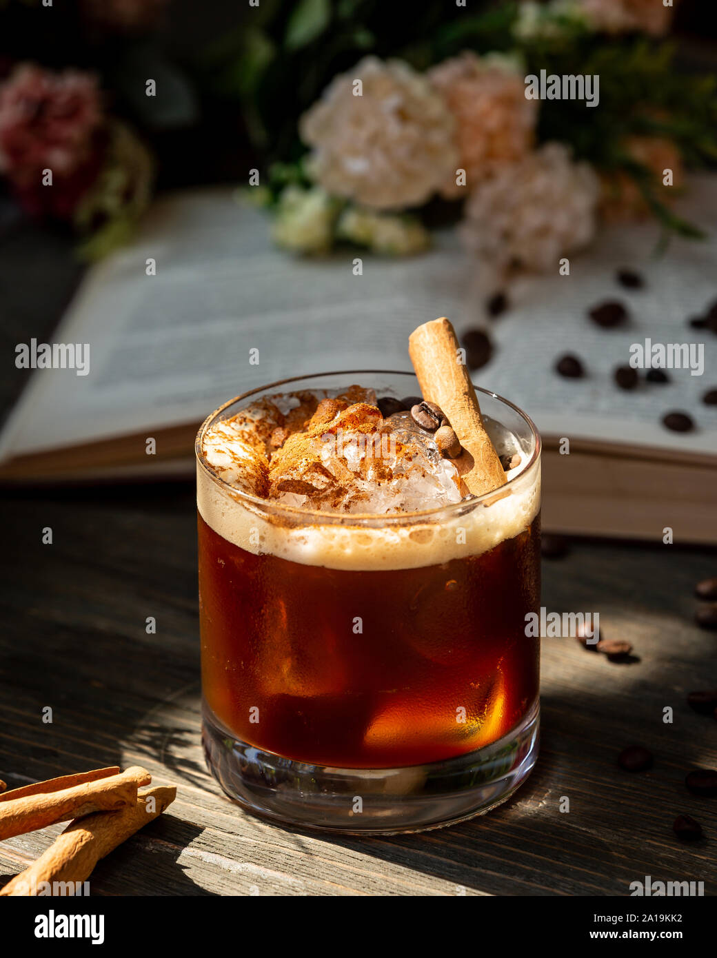 Whiskey with cinnamon on the table Stock Photo