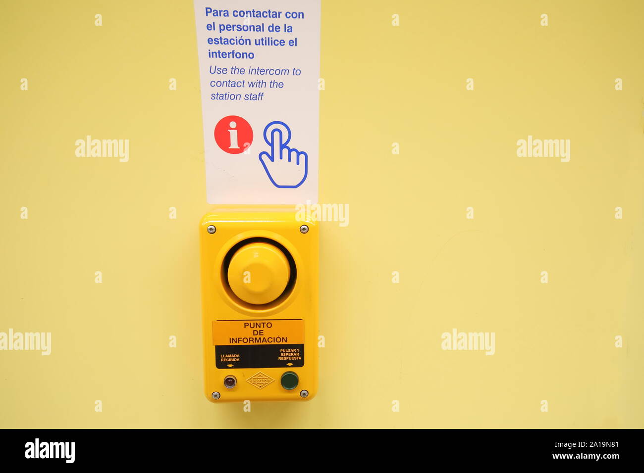 Emergency buzzer button to speak to train station staff Madrid Spain Stock Photo