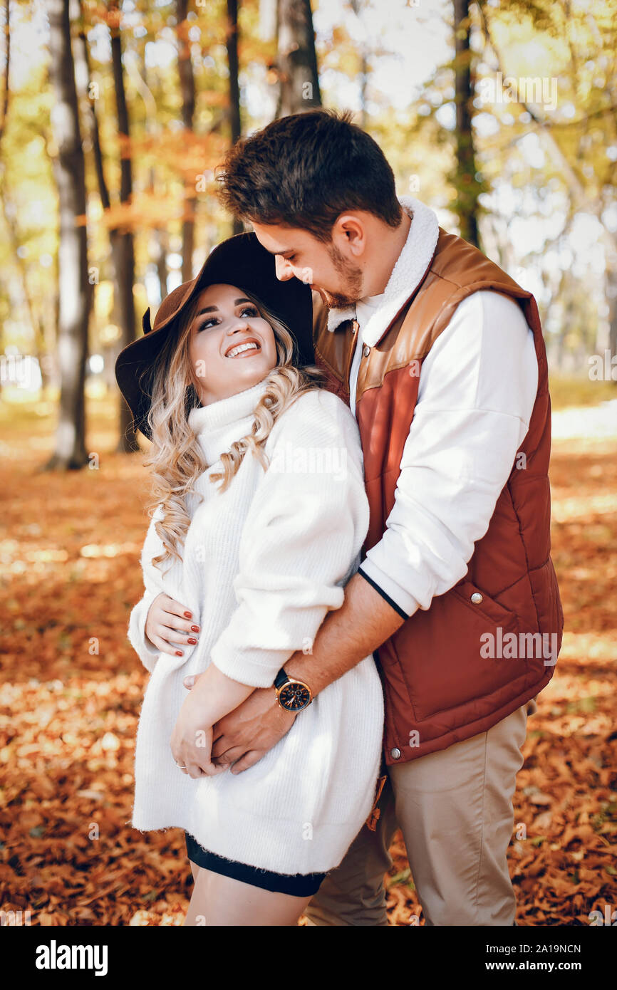 Elegant couple in a sunny autumn park Stock Photo - Alamy