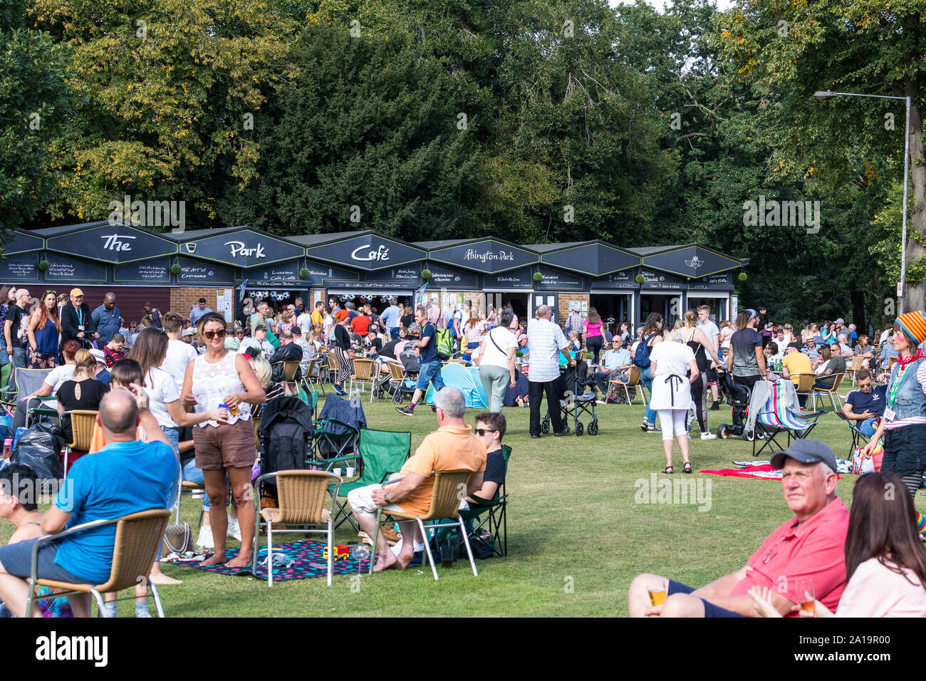 Large number of people outside Abington Park Cafe, Northampton England Stock Photo