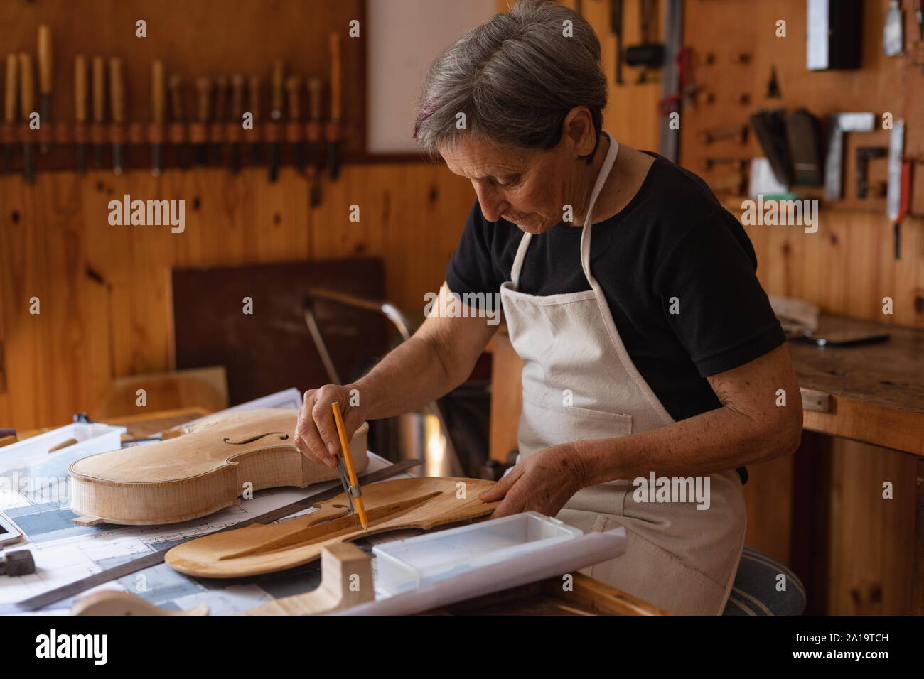 Female luthier at work in a Stock Photo Alamy