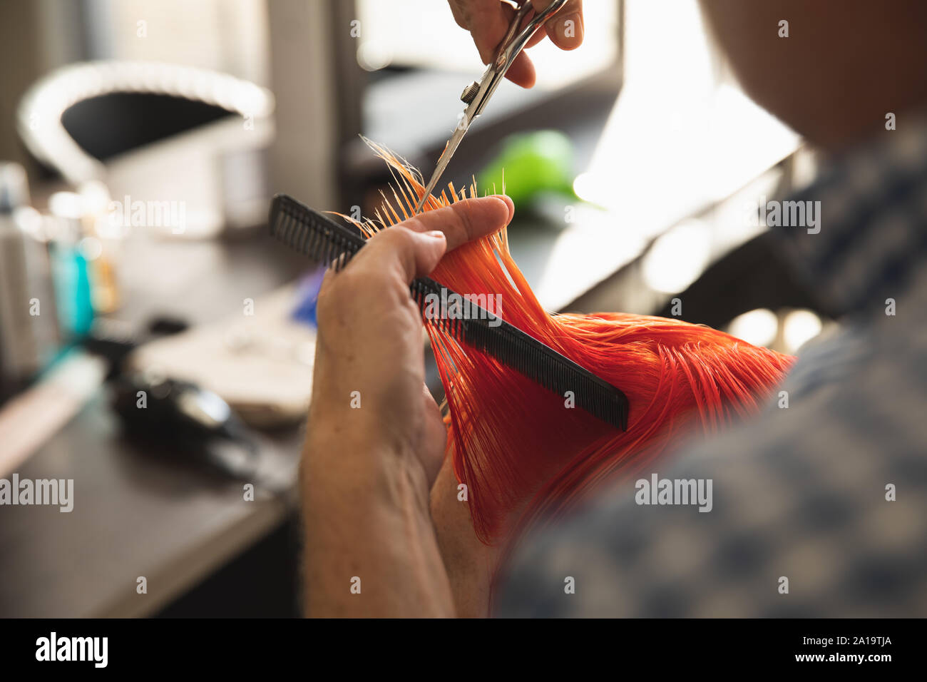 Male hairdresser and female client in hair salon Stock Photo - Alamy