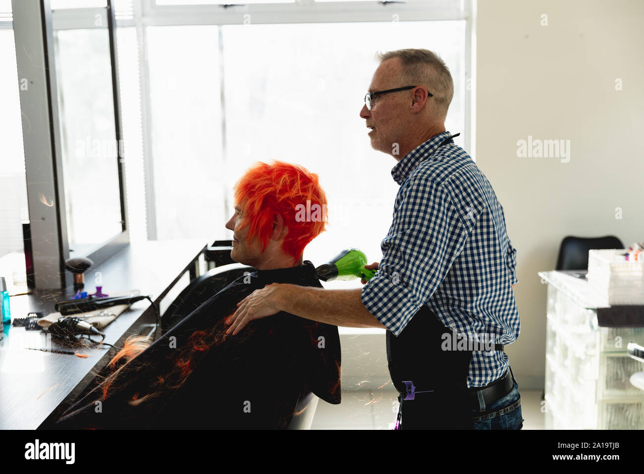 Hair stylist dry in salon hi-res stock photography and images - Alamy