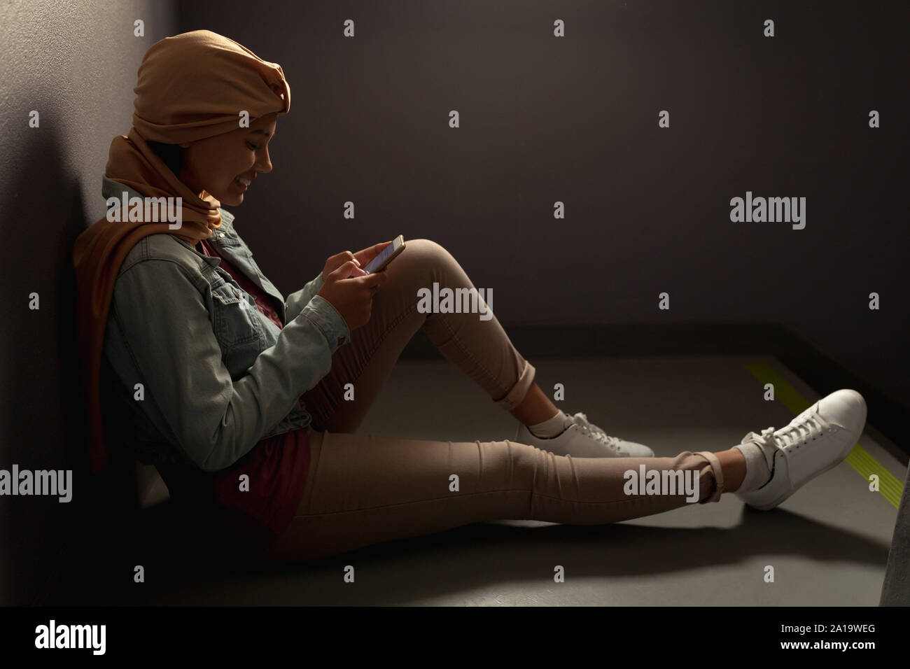 Young woman using smartphone Stock Photo