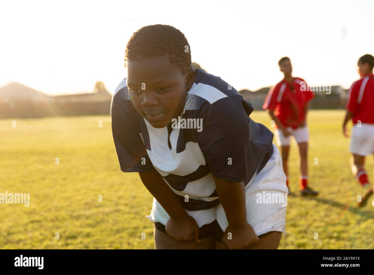 Young adult female rugby player on a rugby pitch Stock Photo