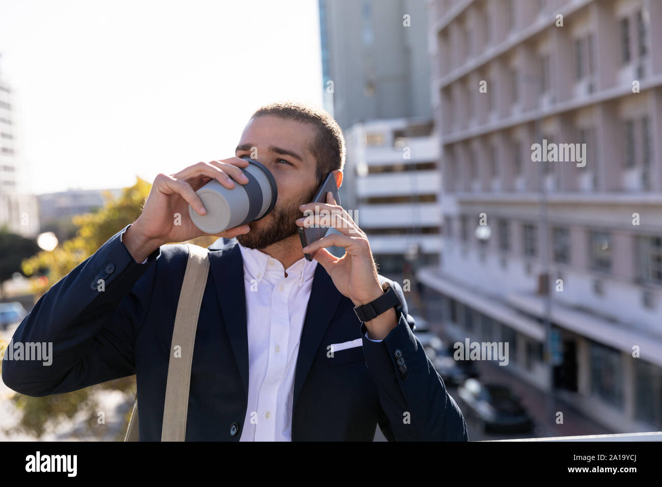 Young professional man on the phone in the city Stock Photo