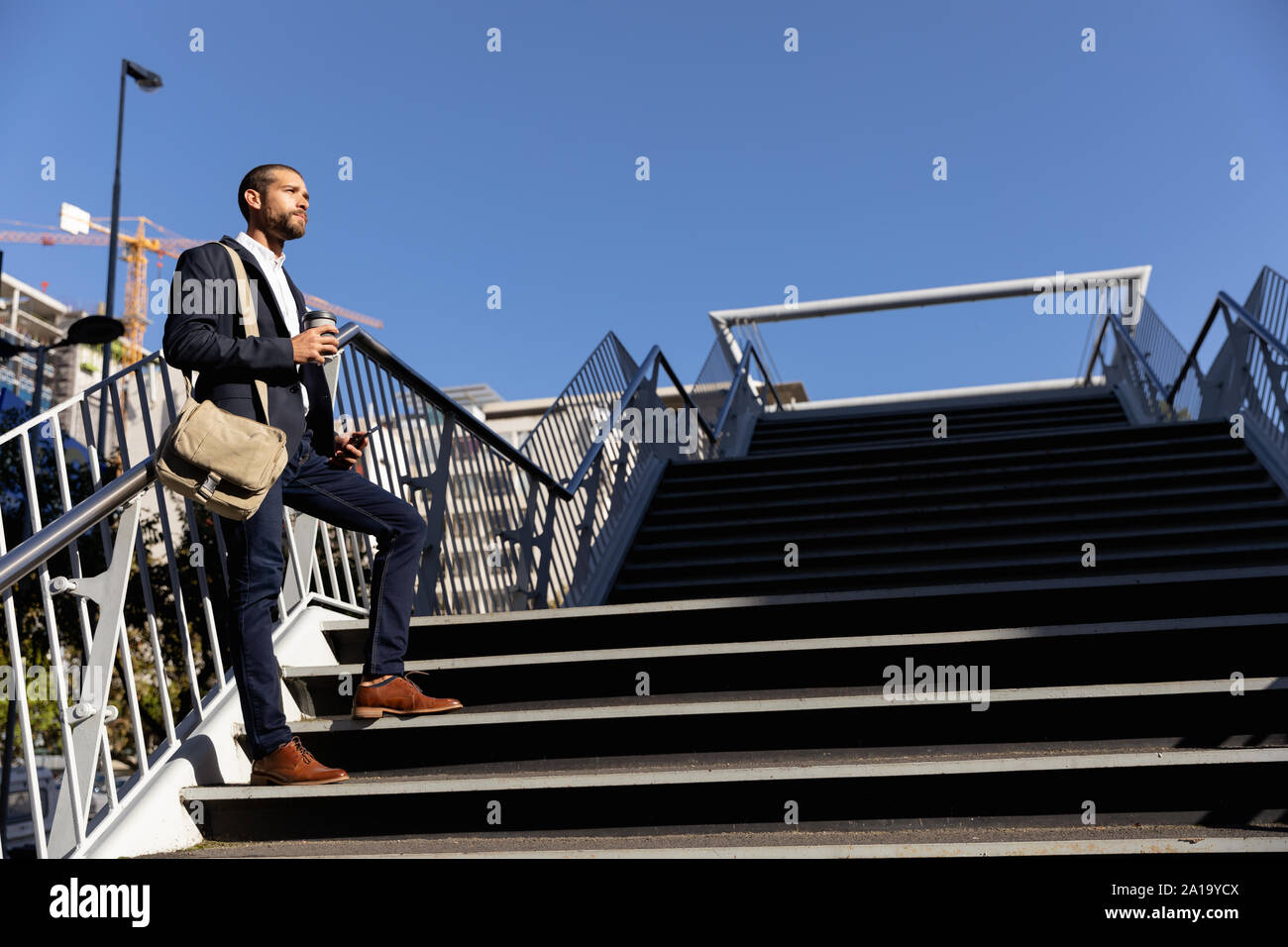 Young professional man taking a break on his way to work Stock Photo