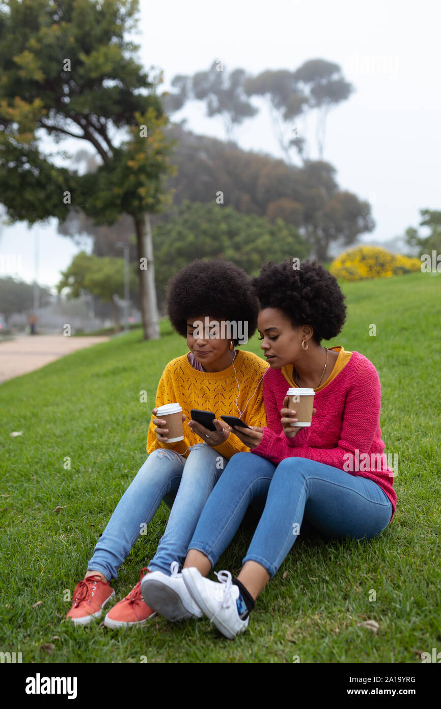 Young women using smartphones Stock Photo