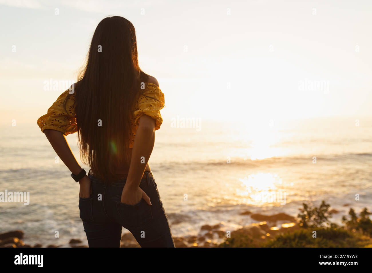 Woman standing in the sea hi-res stock photography and images - Alamy