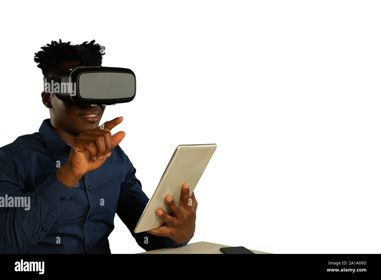 Young businessman using a VR headset Stock Photo