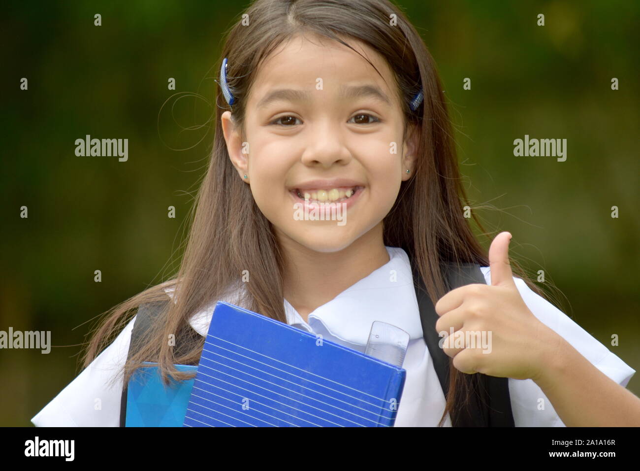 A Girl Student With Thumbs Up Stock Photo - Alamy