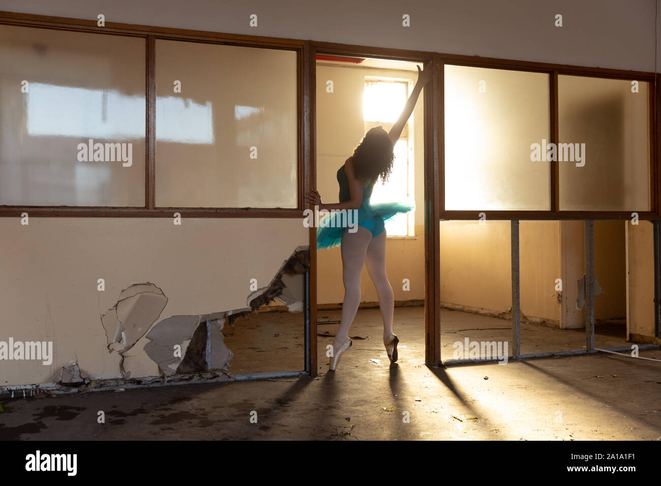 Female dancer in an empty warehouse Stock Photo
