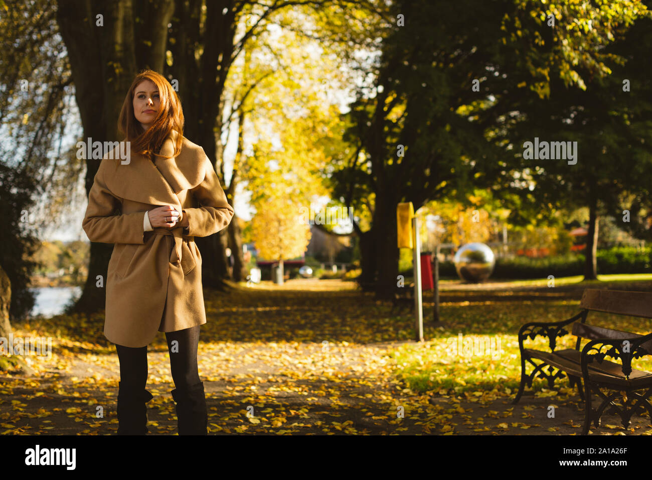 Woman walking on park bench hi-res stock photography and images - Alamy