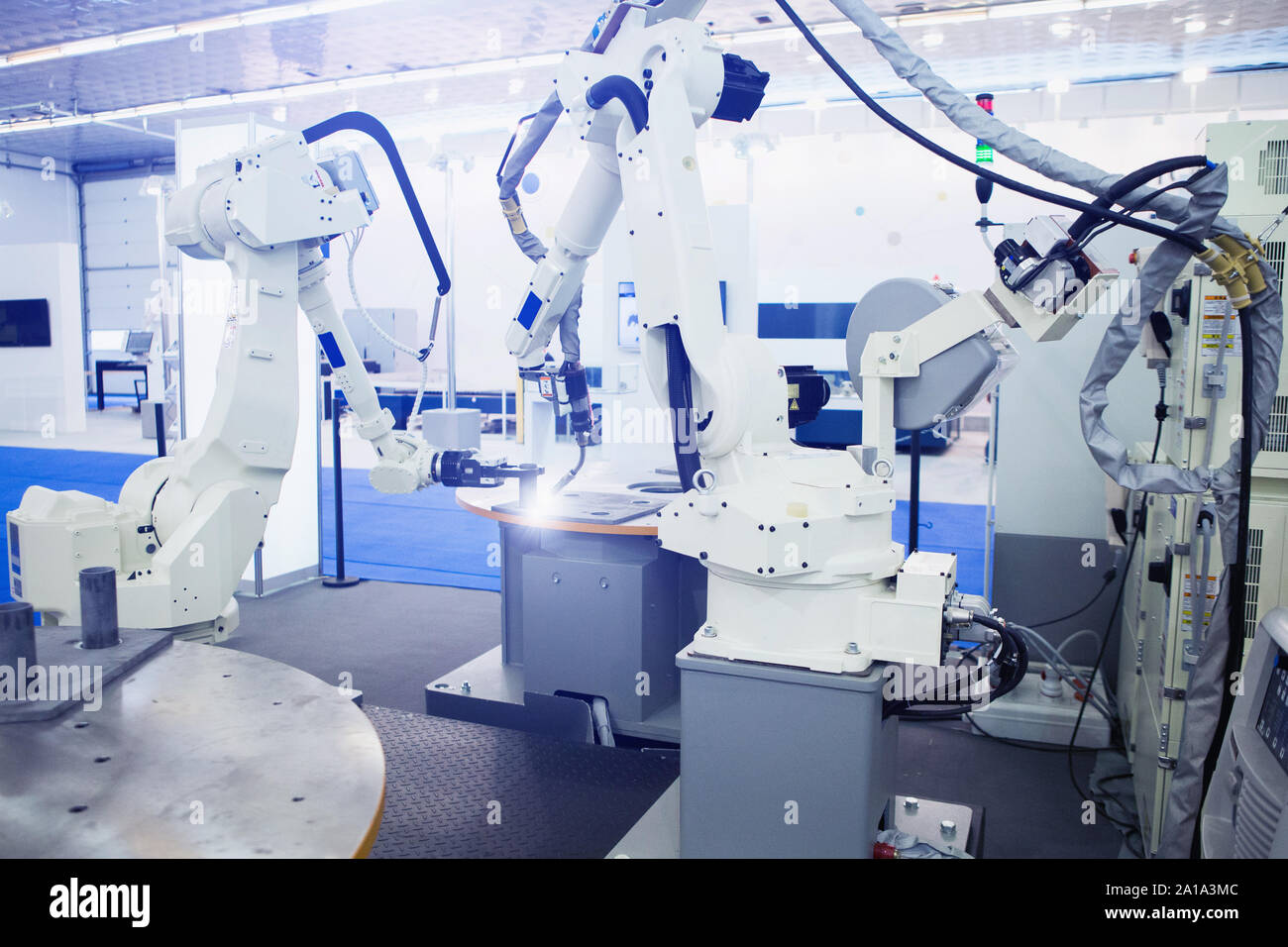 Automatic welding robot in a modern factory in operation. Stock Photo