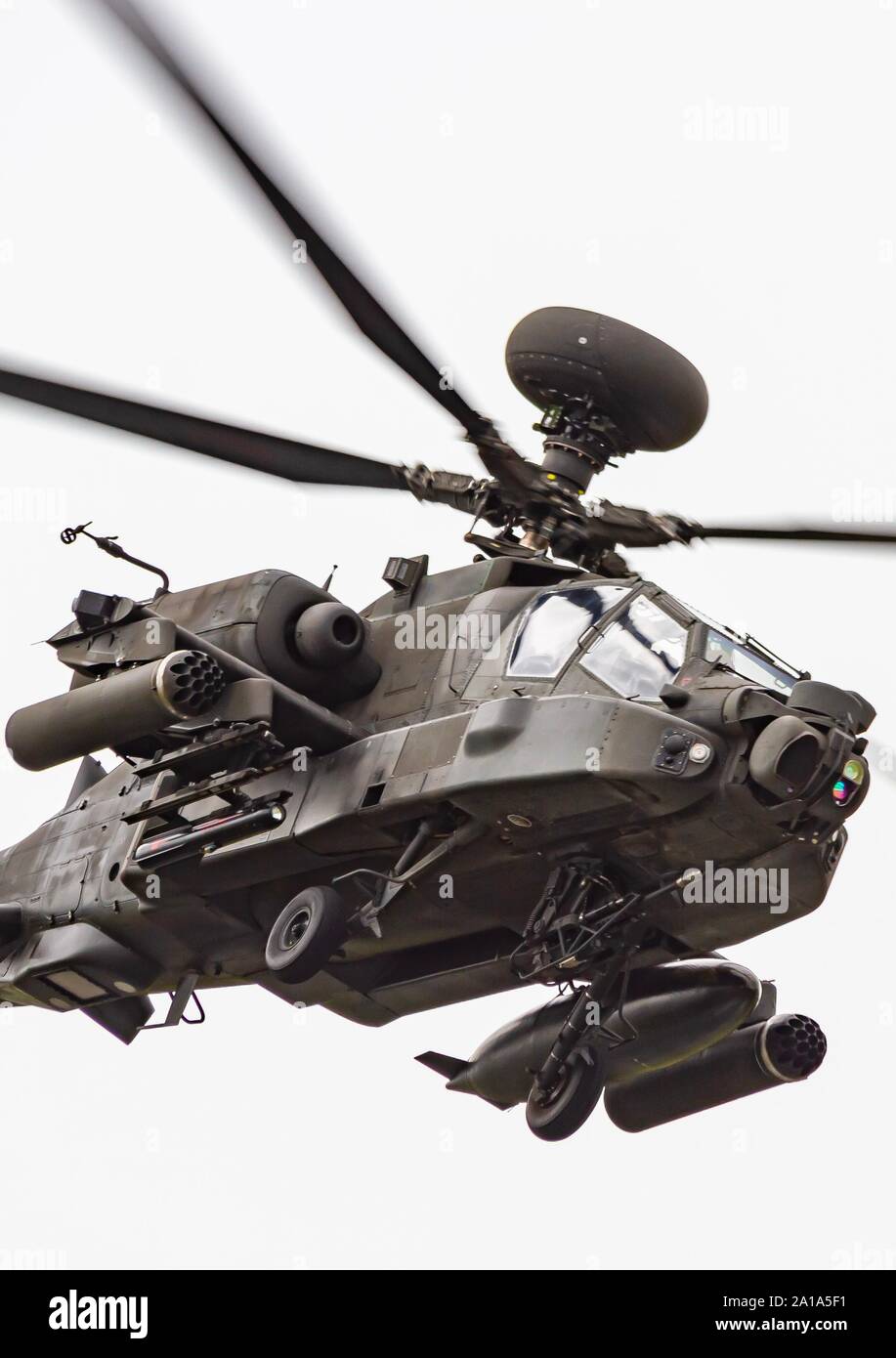 Close up portrait of a Boeing AH64 Apache longbow gunship helicopter in flight Stock Photo