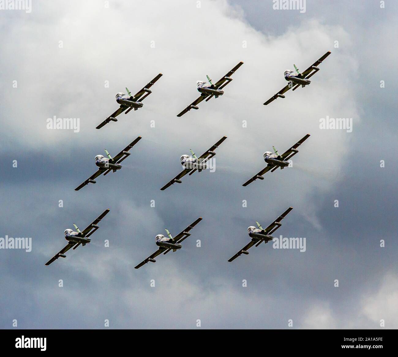 The Italian Frecce Tricolori flying in a tight diamond 9 formation displaying their skill and training Stock Photo