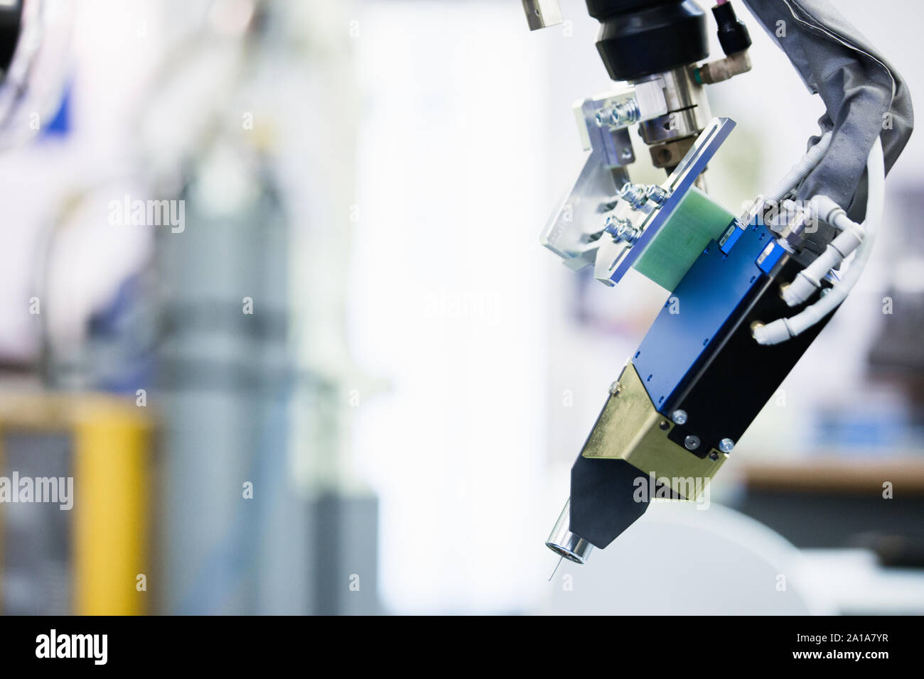 Automatic welding robot in a modern factory in operation. Stock Photo