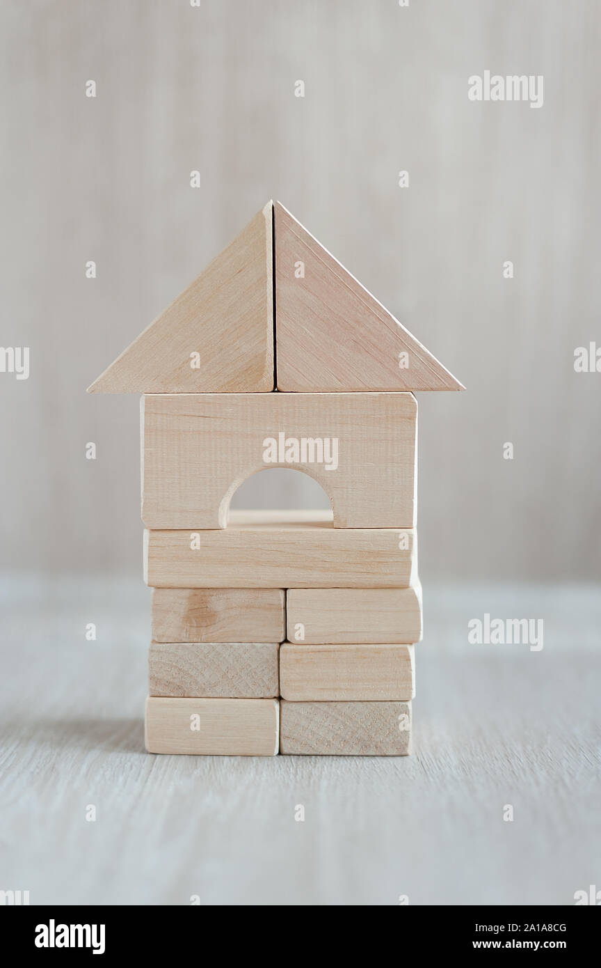 Wooden block house on white background. wooden building blocks