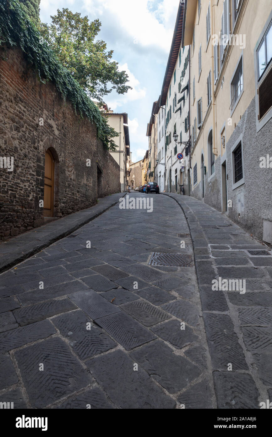 Narrow, hilly, winding street. Florence, Toscana 50125, Italy Stock Photo