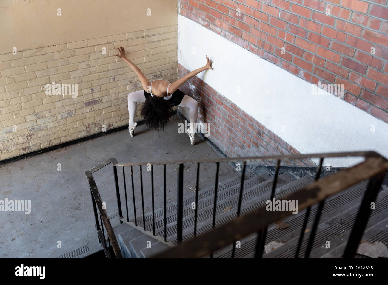 Female dancer in an empty warehouse Stock Photo
