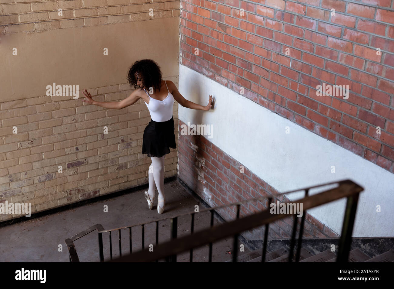 Female dancer in an empty warehouse Stock Photo