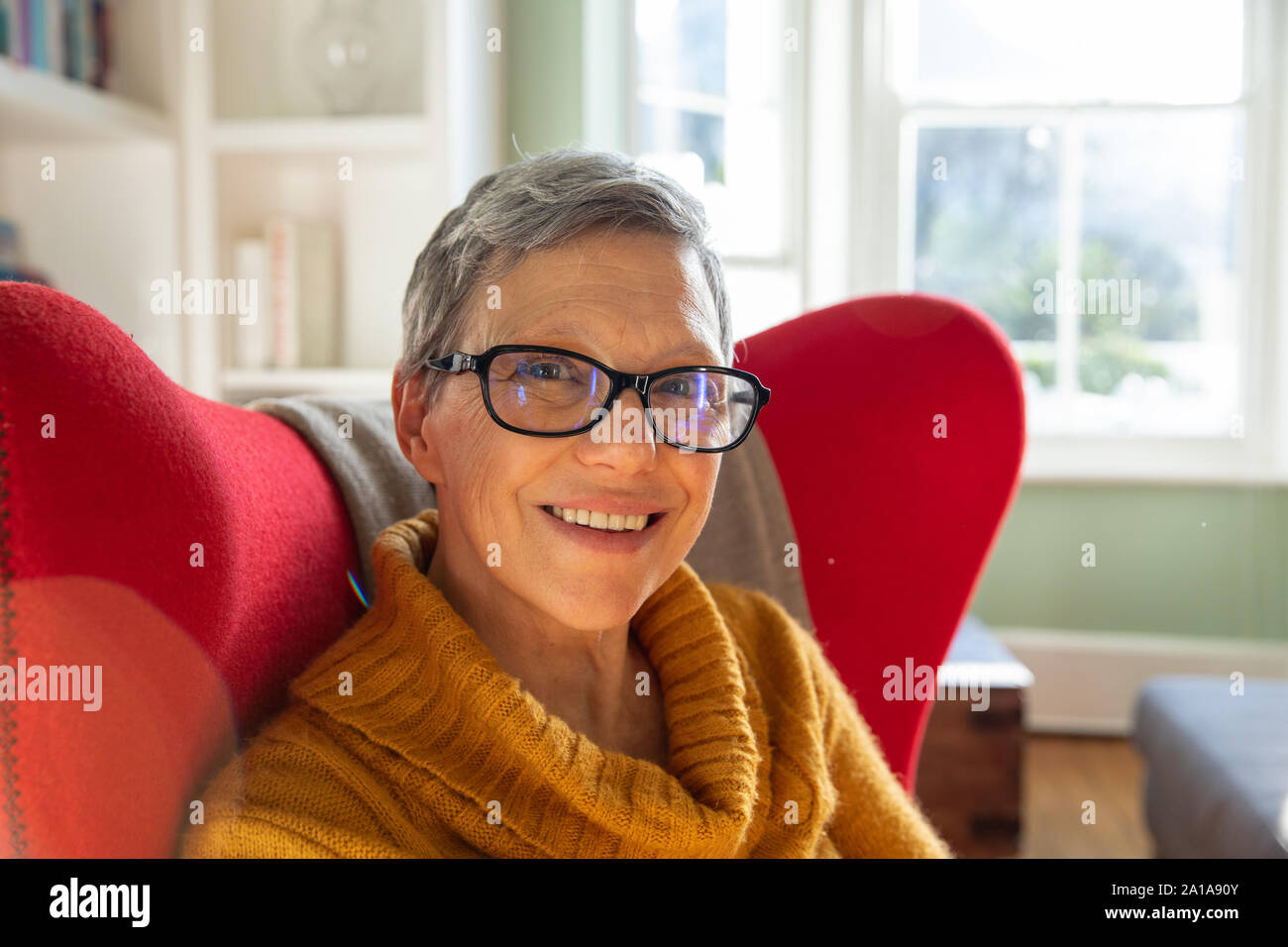 Mature woman alone sitting hi-res stock photography and images - Alamy