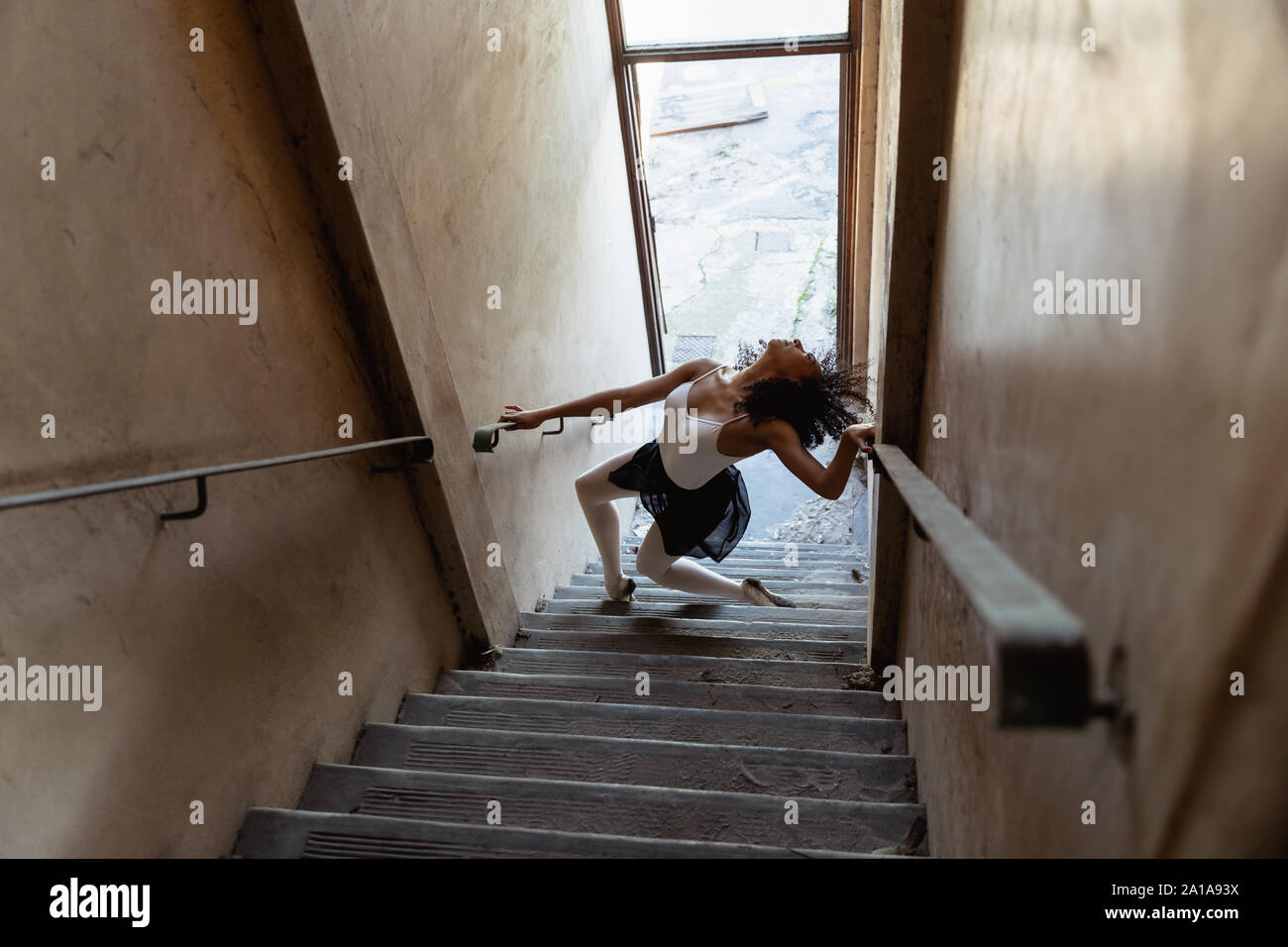 Female dancer in an empty warehouse Stock Photo