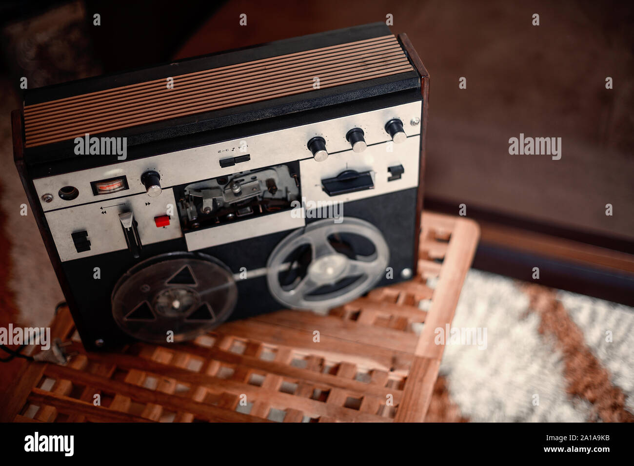 vintage tape recorder with coils of tape. soft selective focus