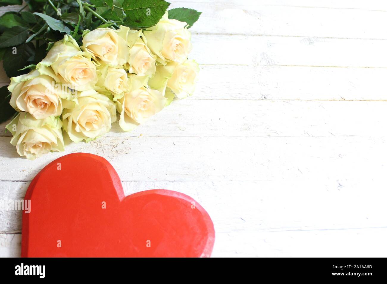 The picture shows white roses and a red heart Stock Photo - Alamy