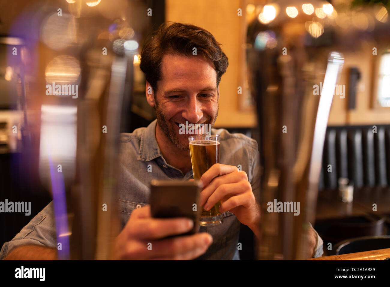 Young man in a bar Stock Photo