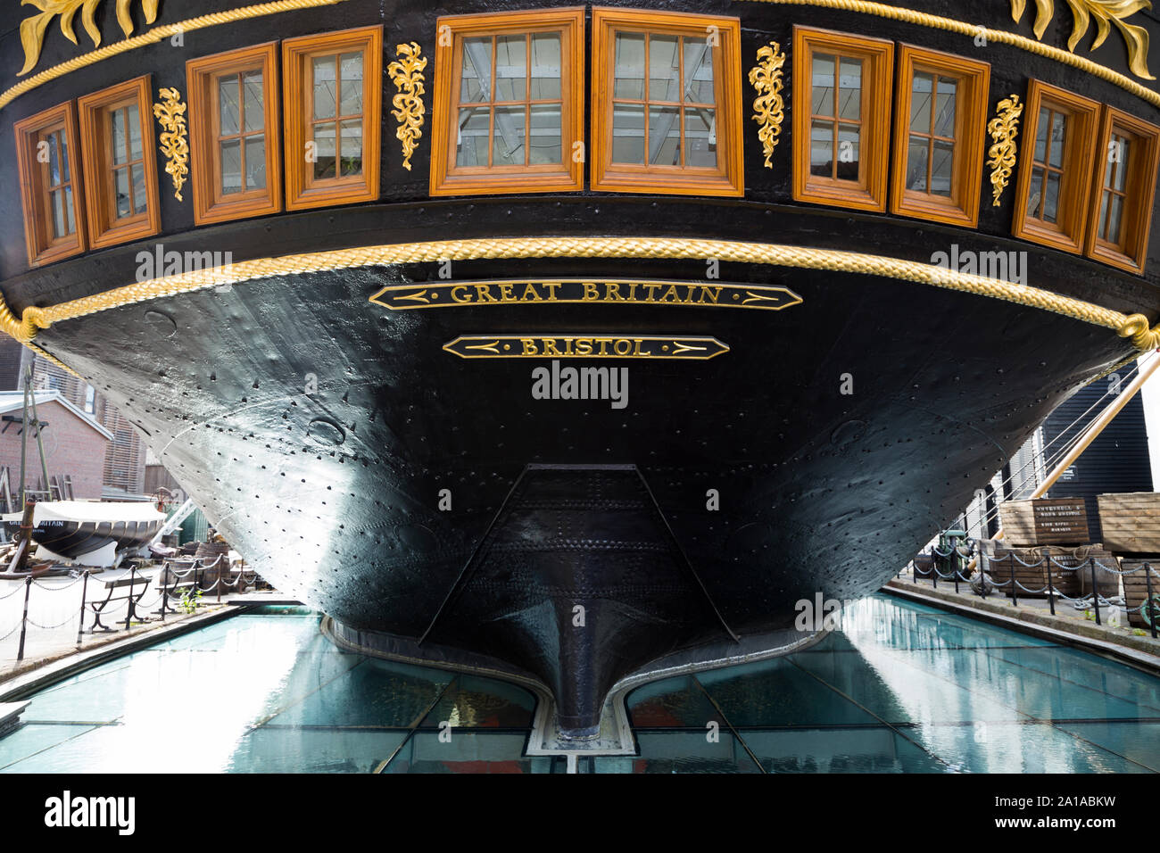 Stern / rear / back of the SS Great Britain, Isambard Kingdom Brunel 's iron ship, and the glass sea of the dry dock, Dockyard Museum in Bristol. UK. (109) Stock Photo