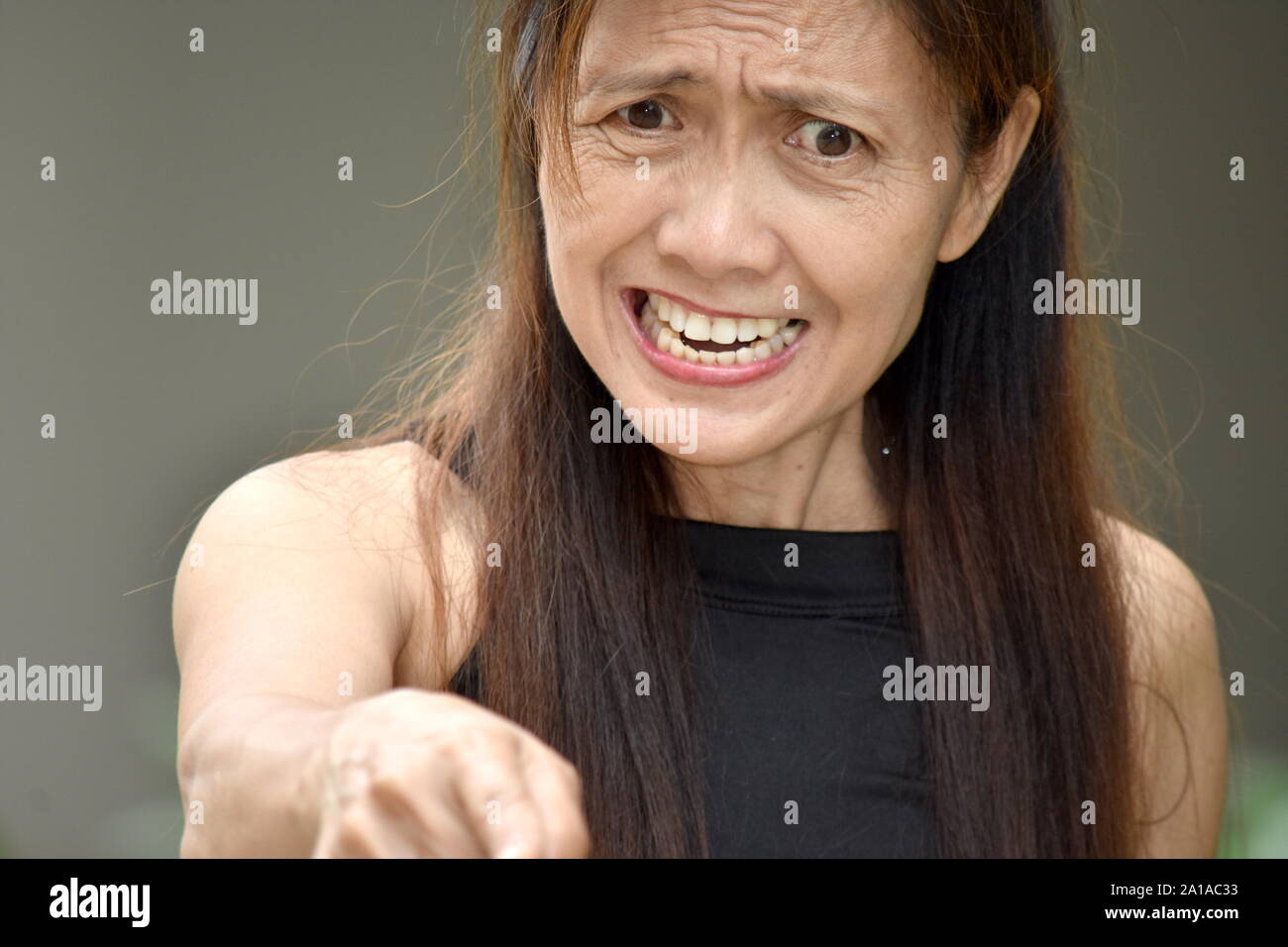 A Mad Retired Asian Adult Female Stock Photo Alamy