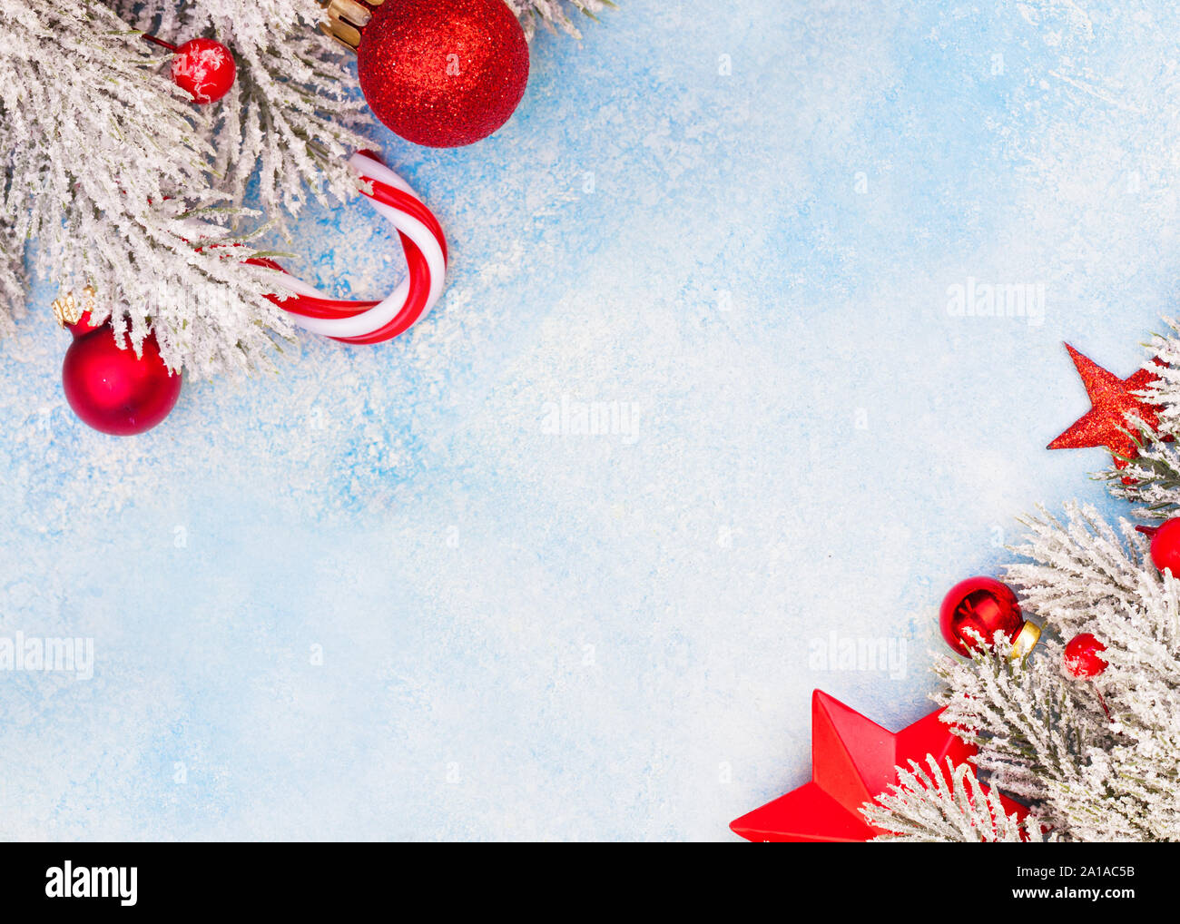 Christmas card. Beautiful Xmas corners on blue frozen background with copy  space Stock Photo - Alamy