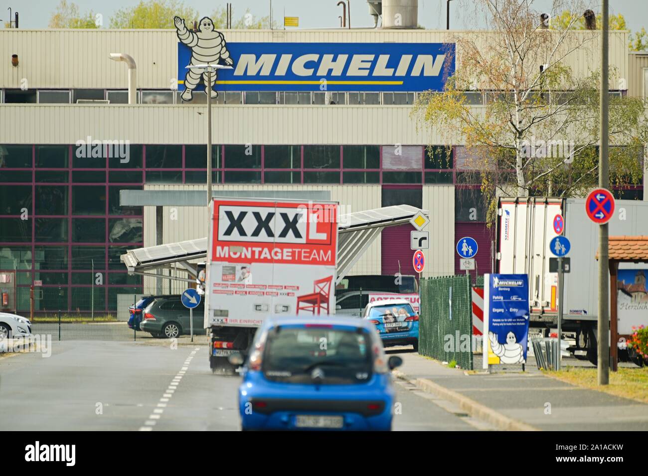Germany. 25th Sep, 2019. In front of the Michelin plant in Hallstadt, a  removal truck drives along. The Michelin Group has announced the closure of  its plant in Hallstadt near Bamberg by