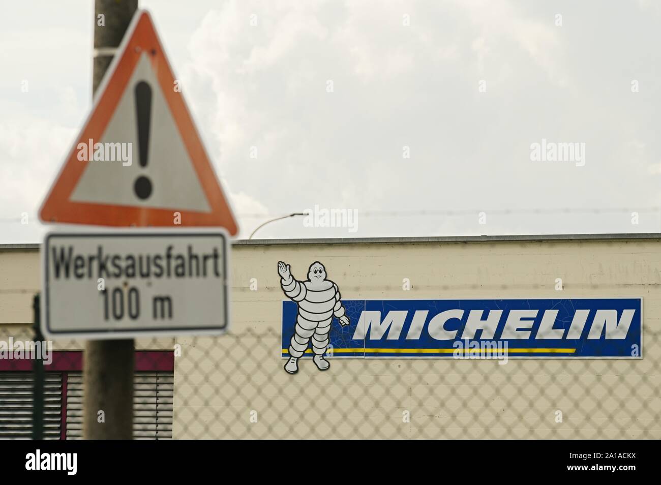 Germany. 25th Sep, 2019. In front of the Michelin plant in Hallstadt, a  removal truck drives along. The Michelin Group has announced the closure of  its plant in Hallstadt near Bamberg by