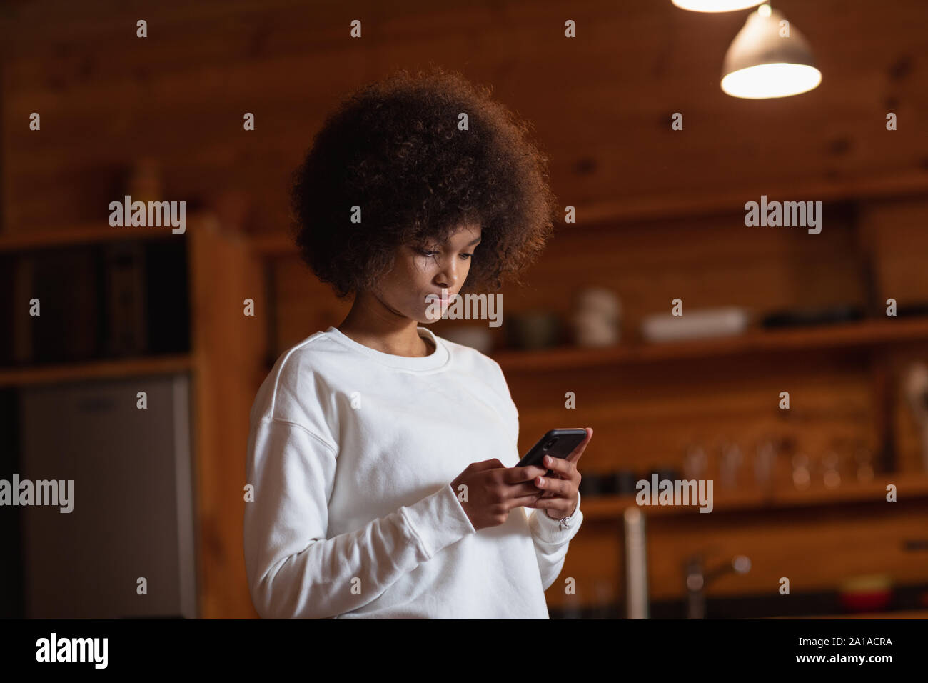 Young woman using smartphone Stock Photo