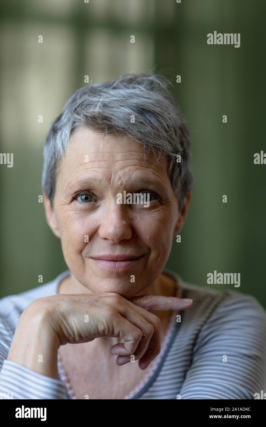 Potrait of a mature woman alone at home Stock Photo